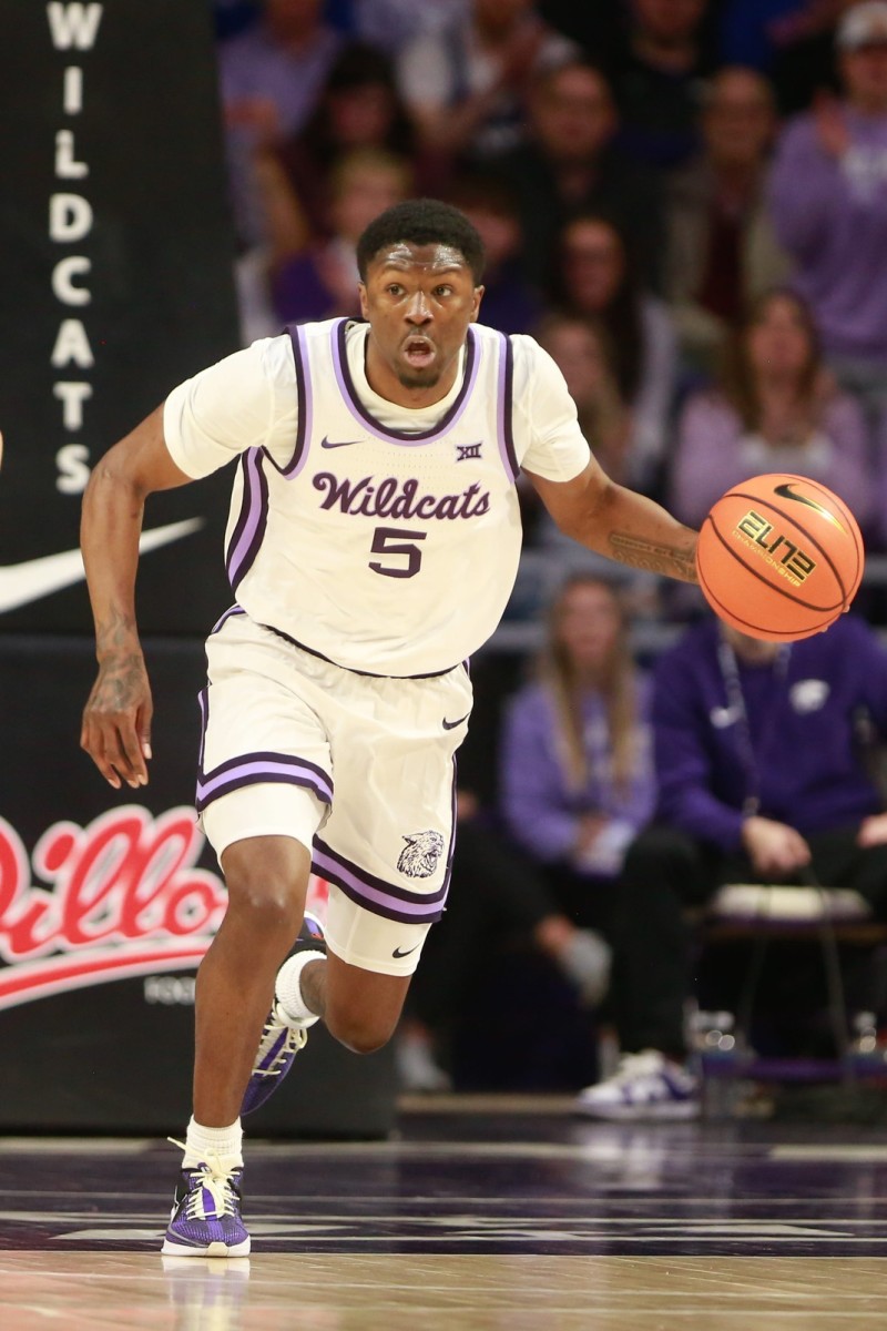 Kansas State junior guard Cam Carter (5) dribbles back a Kansas rebound in the first half of the Sunflower Showdown inside Bramlage Coliseum Monday, February 5, 2024.